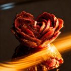 Свічка низькотемпературна у вигляді троянди з глітером GlowKink бордова, L вид 59